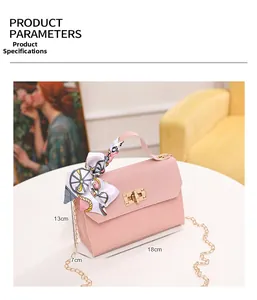 Pink woven handbag with gold clasp, silk scarf handle and 18x13x7 cm dimensions