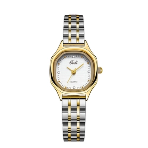 Macro shot of Gedi quartz watch with silver and gold stainless steel band and crystal dial