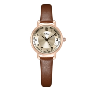 Elegant vintage women's quartz watch with brown leather strap and rose gold round case