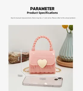 Mini pink jelly handbag with heart lock and size comparison 11x7x9cm shown next to phone