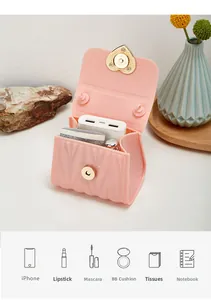 Pink quilted silicone mini bag showing interior capacity for phone and cosmetics