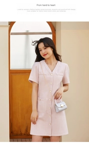 Pink tweed dress paired with a silver quilted handbag featuring a gold heart clasp