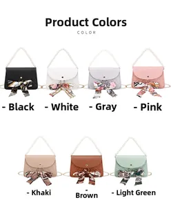Detail view of seven colorful quilted mini bags featuring pearl handles and silk scarves