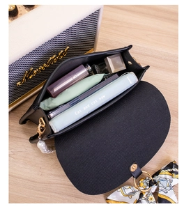 Interior view of the black leather pearl handbag showing spacious storage capacity