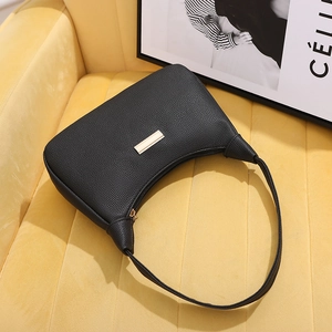 Minimalist black lychee texture crescent underarm bag with gold metal plate detail