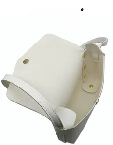 Interior view of white square shoulder bag showing large capacity and striped fabric lining