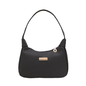 Minimalist black crescent shoulder bag in litchi leather with gold leaf pendant