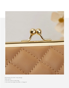 Détail d'un sac en cuir matelassé marron avec fermoir doré vintage et coutures précises