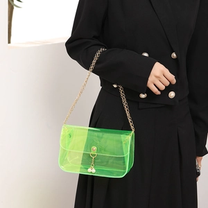 Neon green transparent PVC shoulder bag with gold chain and pearl decoration