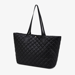 Black quilted tote bag with large capacity and diamond pattern for travel and daily use