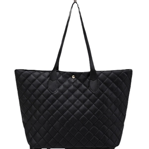 Large black quilted tote bag with diamond pattern and gold button for daily commuting