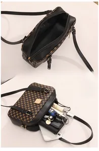 Internal view of large capacity vintage crossbody bag showing ample storage space