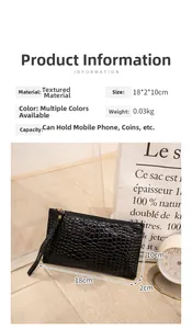 Detail view of black crocodile pattern clutch bag showing dimensions 18x2x10cm and wrist strap