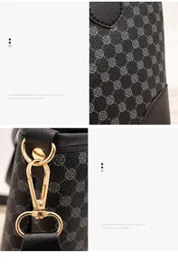 Detail of grey textured tote bag featuring floral embossing and gold hardware hook