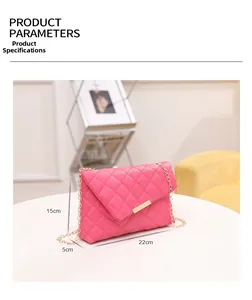 Pink quilted shoulder bag with gold chain strap showing dimensions 22cm x 15cm x 5cm