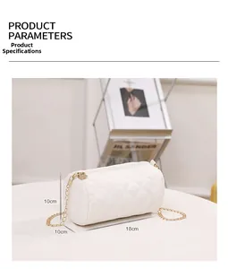Detail view of a white quilted cylinder shoulder bag showing dimensions 18cm by 10cm