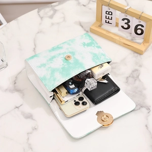 Green marble pattern chain bag with high capacity shown with daily essentials
