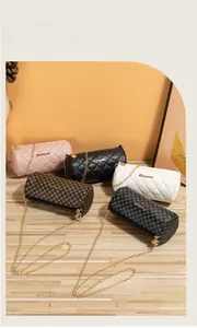 Quilted and monogrammed cylinder chain bags in pink, black, white, and coffee finishes