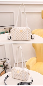 Detail view of white rectangular handbag with gold circular patterns and striped crossbody strap
