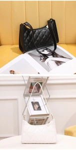 Close-up of quilted crescent shoulder bag featuring premium PU leather and metal zipper detail