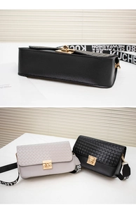Detail showing woven texture flap bag with gold metal twist lock and wide ribbon strap
