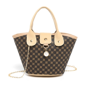 Vintage dark brown bucket bag with clover pattern and pearl pendant charm detail