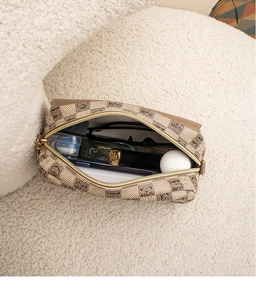 Top view of open checkered shell bag showing spacious interior with daily essentials