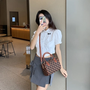 Brown checkered Boston bag with CH monogram print and adjustable shoulder strap