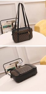 Detail of vintage brown monogram handbag with dual straps and front zipper pocket