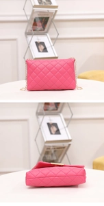 Detail view of pink quilted handbag with gold chain strap and metallic hardware