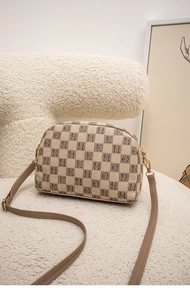 Detail of checkered canvas crossbody bag with R and H letter prints and leather strap