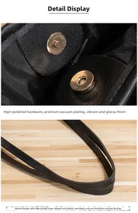 Détail de la boucle magnétique en métal poli et de la poignée en cuir renforcé du sac