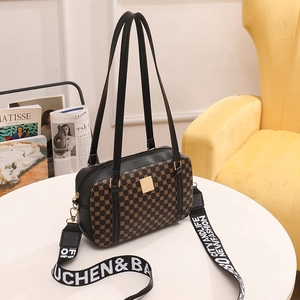 Vintage black crossbody bag with geometric pattern and wide 'CITY AND LIFE' strap