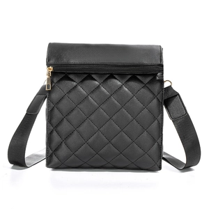Classic black quilted crossbody bag with golden zipper and wide adjustable strap