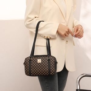 Retro brown crossbody bag with gold geometric patterns and black leather shoulder strap