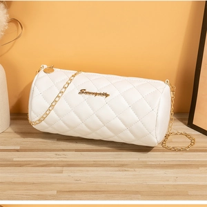 Detail of white quilted cylinder bag with gold chain strap and Seunnycity metal logo