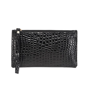 Sleek black crocodile pattern wristlet purse with glossy finish and secure zipper