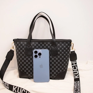 Large vintage tote bag with grey geometric patterns and wide crossbody strap