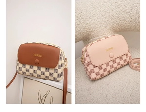 Close-up of brown and pink plaid crossbody shell bags with golden logo detailing