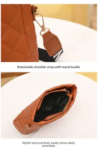 Detail view of the brown quilted bag showing detachable hardware and spacious interior