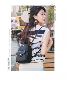 Detailed view of black quilted PU leather backpack with magnetic flap front pocket on model