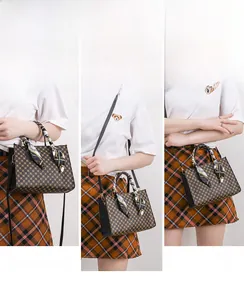 Three-way carry demonstration of printed handbag with decorative silk scarf
