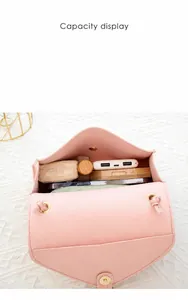 Pink felt crossbody bag internal capacity display showing phone and power bank
