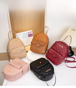 Detail of quilted leather mini backpacks in beige, brown, red, pink, and black colors