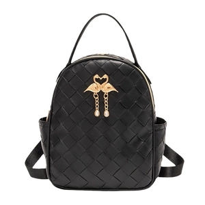 Mini black quilted backpack with golden flamingo hardware and rhinestone tassels