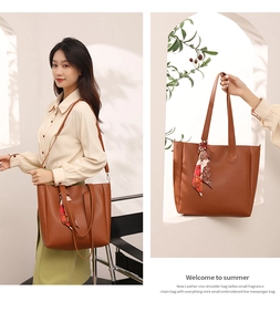 Brown leather tote bag with printed silk scarf detail shown in lifestyle setting