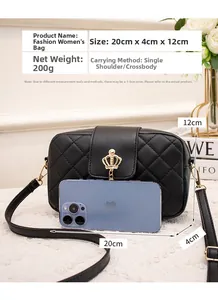 Quilted black bag with gold crown buckle and dimensions 20cm x 4cm x 12cm shown with phone