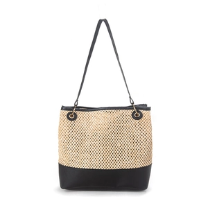 Minimalist beige woven tote bag with durable black leather base and slim handles