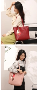 Detail showing a minimalist tote bag with decorative silk scarf and large capacity