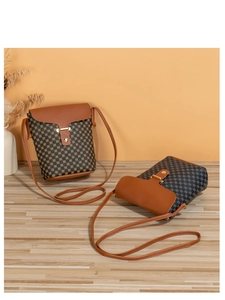 Detailed view of vintage checkered crossbody phone bags with leather straps and gold clasps